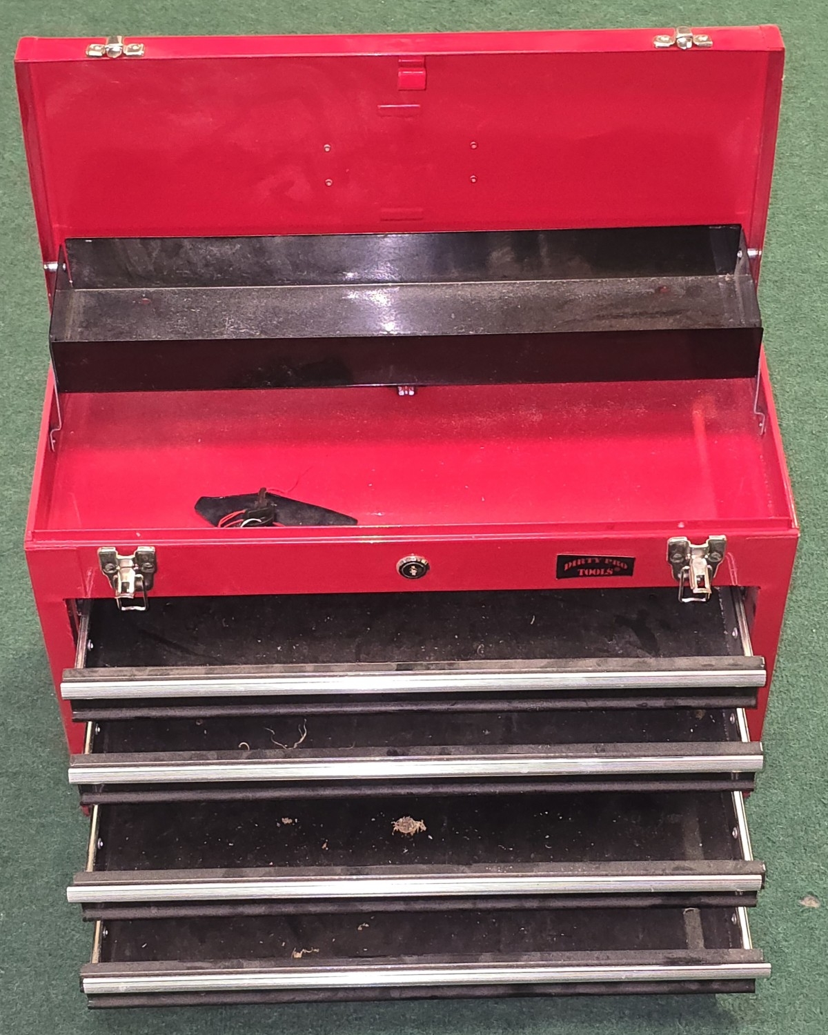 A red lockable tool box fitted with top storage and four drawers ...