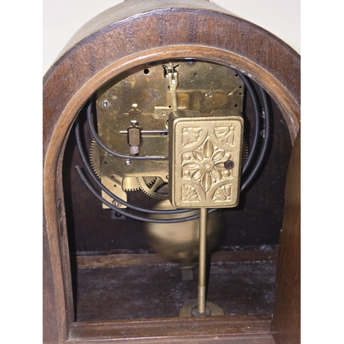 19 - A vintage Napoleon Hat striking mantel clock c/w pendulum and key in working order together with a v... 