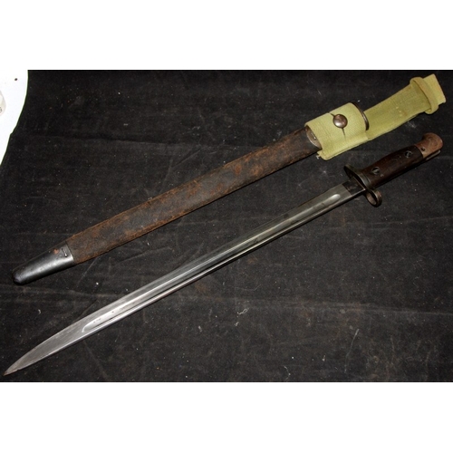 140 - WWI era 1907 Pattern sword bayonet c/w webbing frog and scabbard. Good foundry/armoury stamps. Sold ... 
