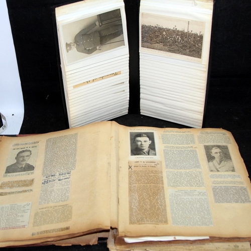 143 - Interesting WWI scrapbook containing newspaper cuttings featuring news stories, obituaries, medal ci... 