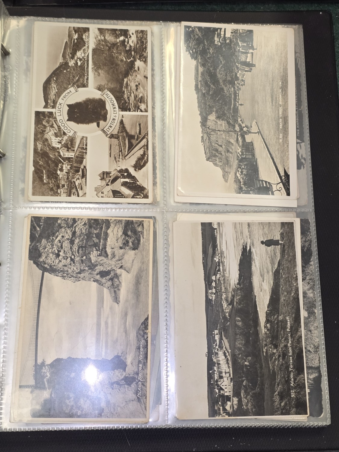 A very large collection of postcards in two albums and a box of loose ...