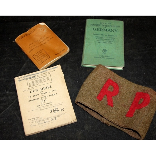 146 - WWII era woolen khaki RP arm band. 1941 Gun drill for 25-PR Mk II gun pocket book, c/w fold out draw... 