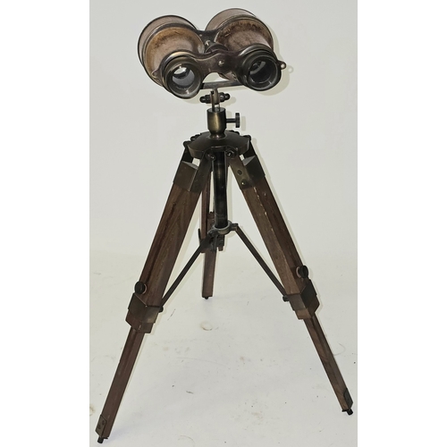36 - A reproduction nautical style brass binocular telescope on wooden tripod base approx 40cm tall.