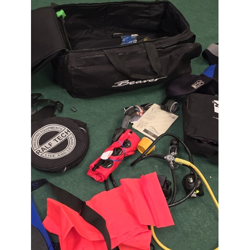 56 - A collection of diving gear to include breathing apparatus and wetsuits.