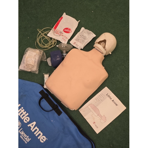 39 - A Laerdal Little Anne CPR trainer.