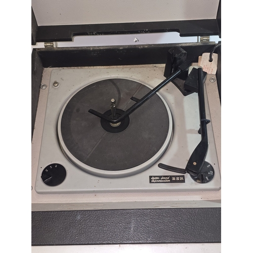 46 - A vintage 1960s Bush RP60 portable record player. Powers on and turntable spins. Amplifier working b... 