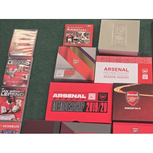 58 - A large collection of Arsenal FC memorabilia to include membership packs, DVD's, Matchday Programmes... 