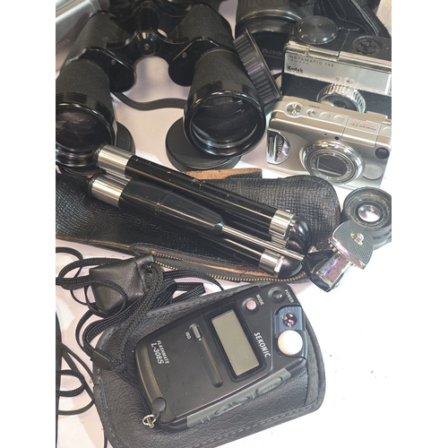 60 - A collection of various cameras, video cameras, binoculars and accessories.