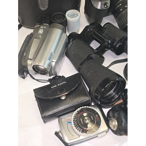 60 - A collection of various cameras, video cameras, binoculars and accessories.