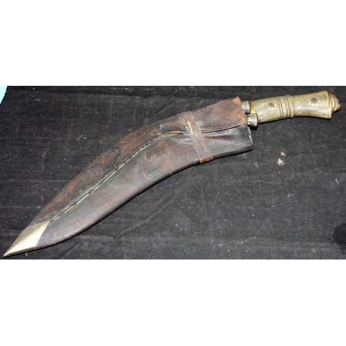 31 - Vintage Nepalese Kukri with lions head finial in leather sheath c/w associated Karda and Chakmak