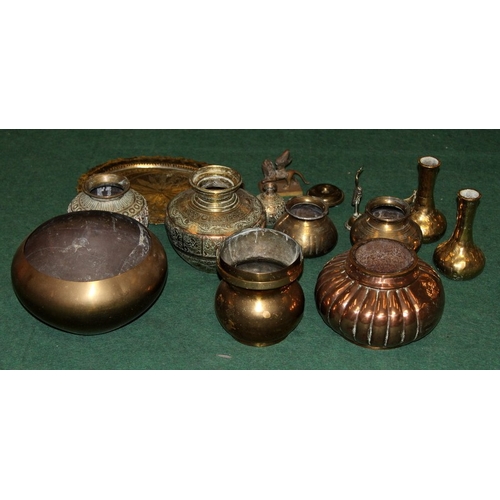 43 - A collection of copper and brass vessels and ornaments