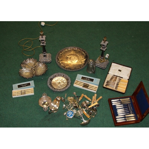 48 - A large quantity of silver plate, a pair of candlesticks, flatware, serving platters etc. Includes 1... 