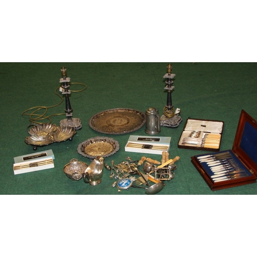 48 - A large quantity of silver plate, a pair of candlesticks, flatware, serving platters etc. Includes 1... 