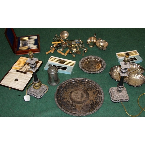 48 - A large quantity of silver plate, a pair of candlesticks, flatware, serving platters etc. Includes 1... 
