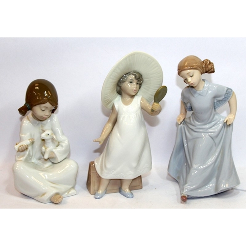 15 - A collection of 1 Lladro and 6 Nao figures of young girls, the largest being 29cms tall