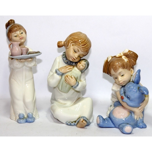 7 - A collection of Nao figures featuring children before bedtime. 5 in lot