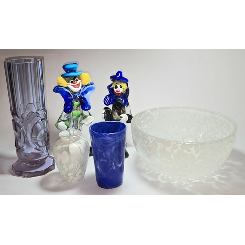 13 - A quantity of assorted coloured glassware to include two Murano clowns.