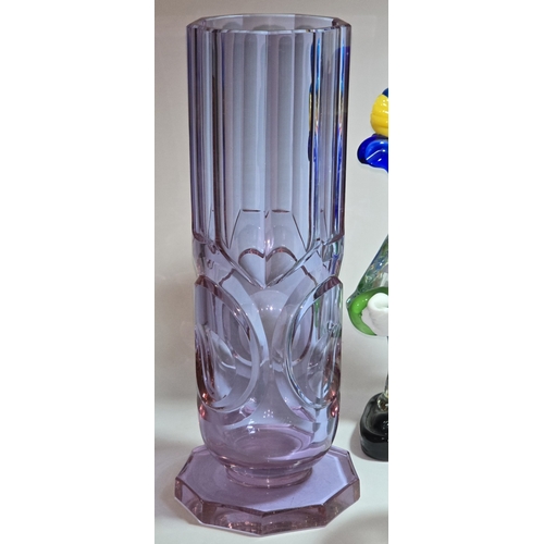 13 - A quantity of assorted coloured glassware to include two Murano clowns.