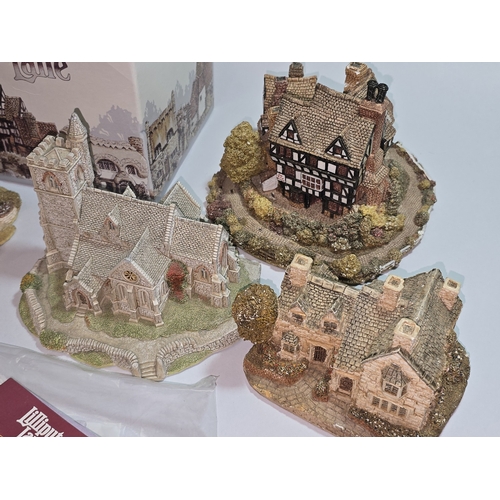 41 - A collection of mostly unboxed Lilliput Lane models to include some paperwork/deeds. Nine models in ... 