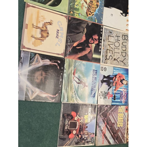 53 - A collection of Pop/Rock/Prog vinyl LP records to include Camel, The Rolling Stones, The Beatles etc... 