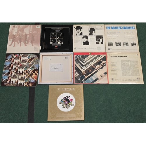 59 - A collection of The Beatles vinyl LP records to include Help!, Let It Be, With The Beatles etc. Some... 
