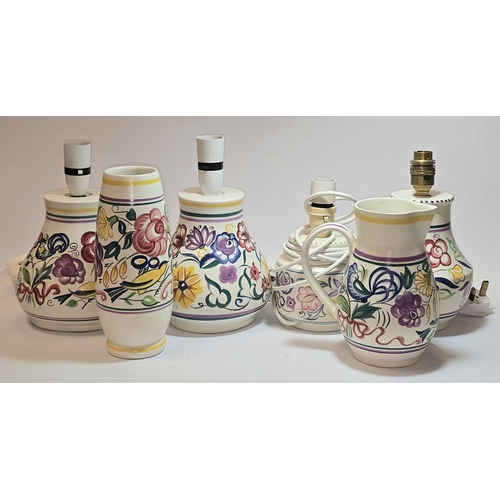 31 - Poole Pottery qty of traditional to include four lamp bases, water jug and vase (6).