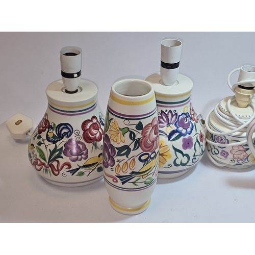 31 - Poole Pottery qty of traditional to include four lamp bases, water jug and vase (6).
