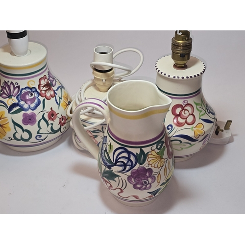 31 - Poole Pottery qty of traditional to include four lamp bases, water jug and vase (6).