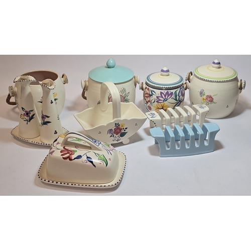 33 - Poole Pottery qty of traditional to include biscuit barrels, toast racks, butter dish etc (9).