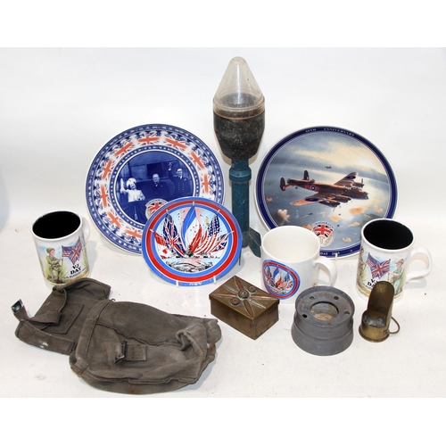 A small collection of military related items to include an inert ...