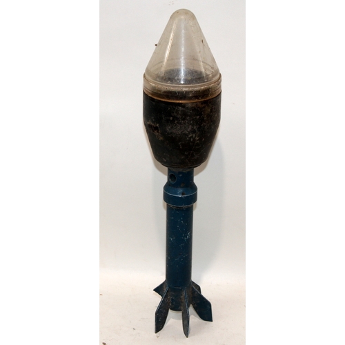 A small collection of military related items to include an inert ...
