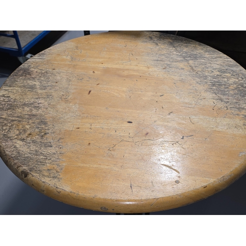A vintage wooden topped pub table with heavy black painted cast metal ...