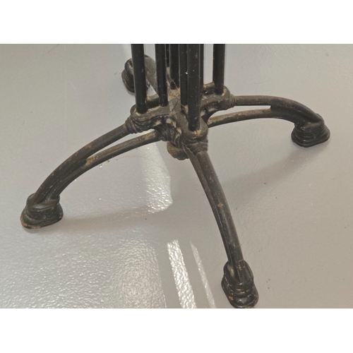 A vintage wooden topped pub table with heavy black painted cast metal ...