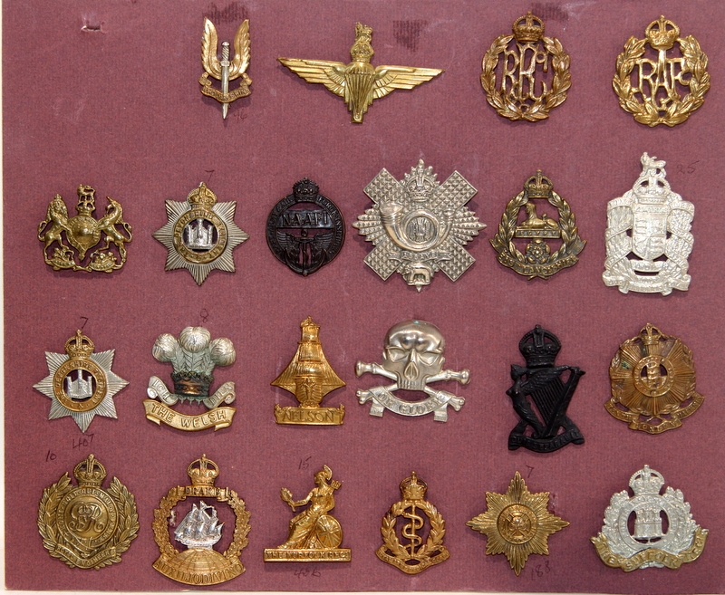 A good carded selection of military cap badges, various eras. Includes ...
