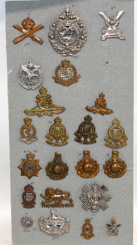 A good carded selection of military cap badges, various eras. 22 in lot