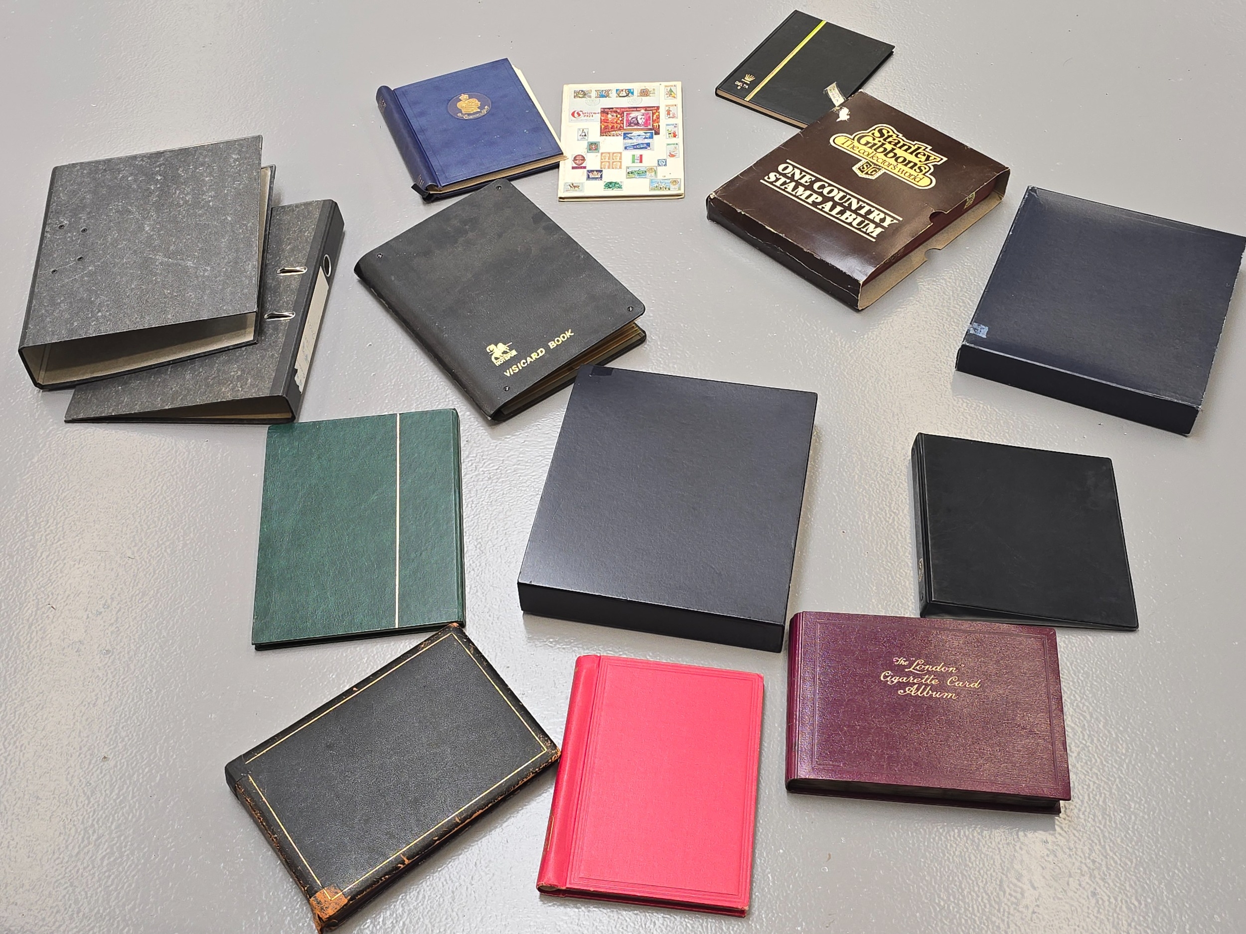 A large collection of empty stamp albums, binders, coin albums etc.