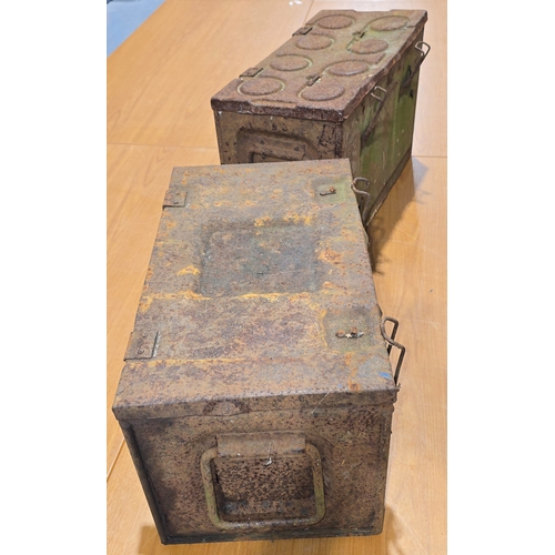 A pair of vintage metal ammunition boxes.