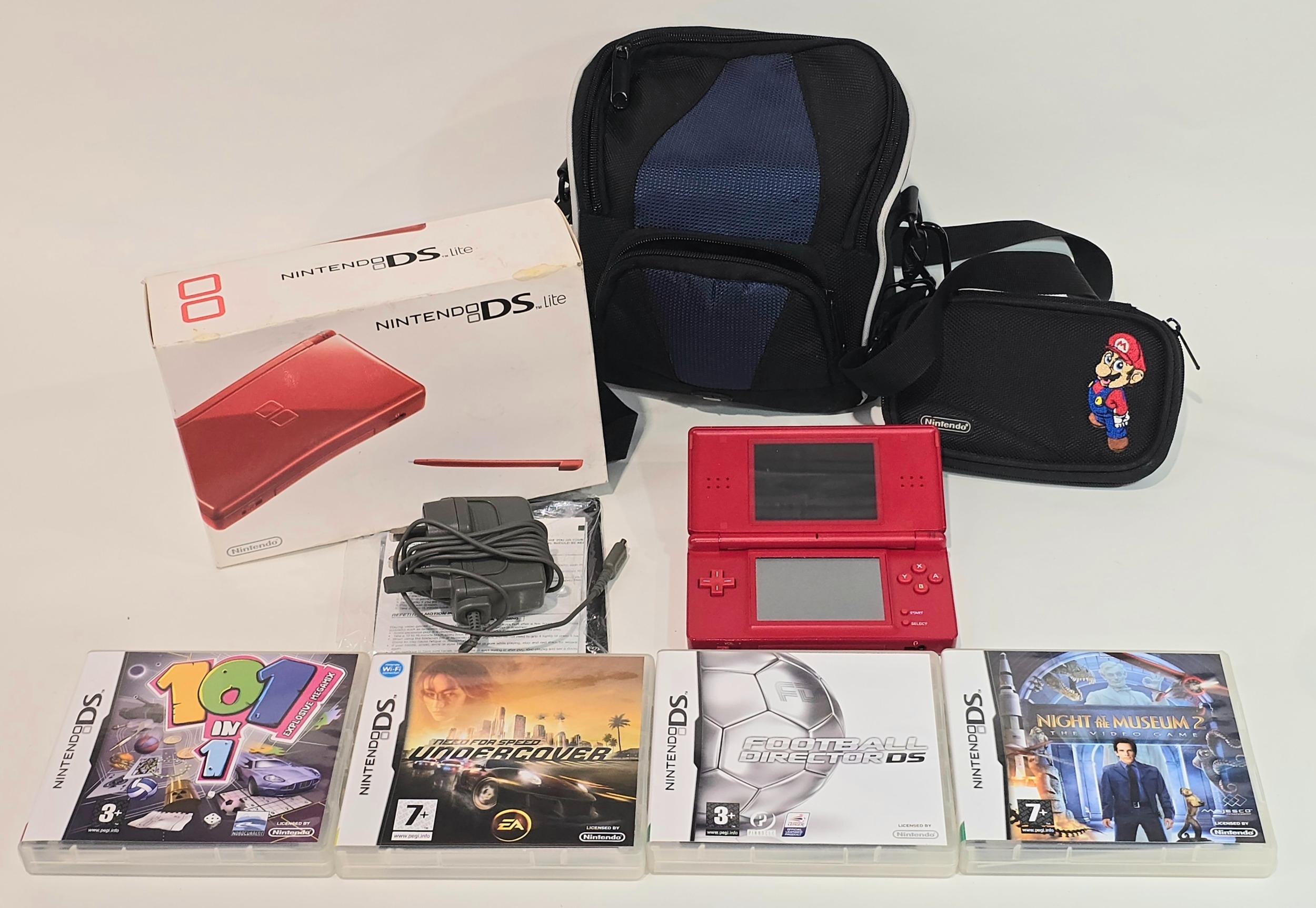 A red Nintendo DS Lite handheld gaming console c/w original box and ...