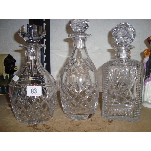 83 - 3 CUT GLASS DECANTERS