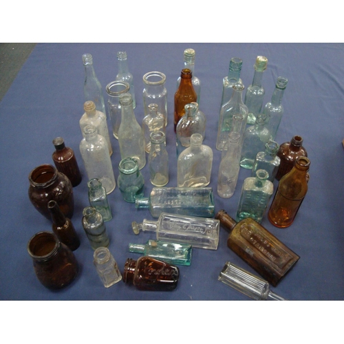 29 - QUANTITY OF GLASS BOTTLES