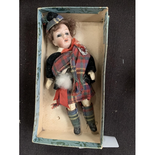 560 - HIGHLAND DRESSED DOLL WITH CHINA FACE