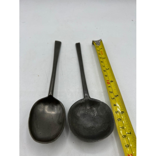 522 - PEWTER HAND FORGED SPOONS TWO PEWTER HAND FORGED SPOONS  17TH CENTURY CLAW SUPPORT