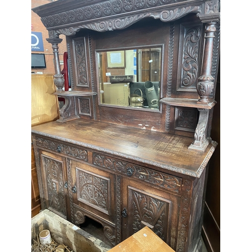 708 - CARVED SIDEBOARD