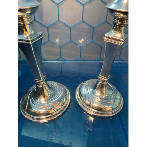 308 - 2 LARGER CANDLESTICKS BIRMINGHAM 1912 MAKERS HERBERT BUSHELL & SON LTD
776 GRAMS