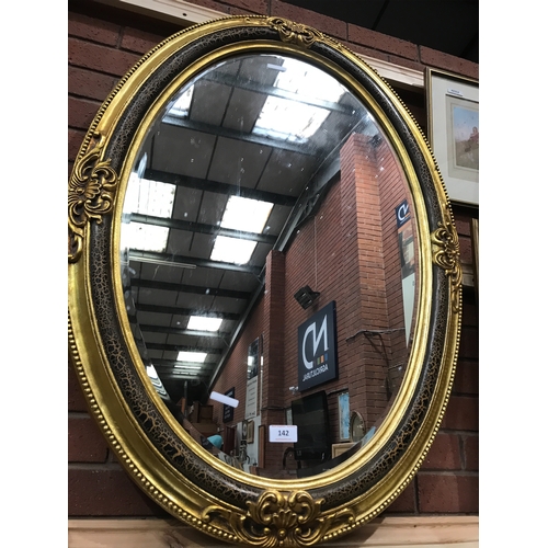 142 - OVAL GILT MIRROR