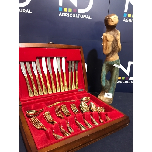 419 - BOX OF CUTLERY & WOODEN FIGURE