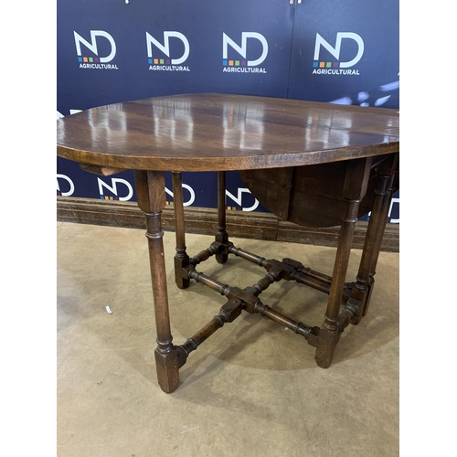 81 - DROP LEAF ROUND TABLE