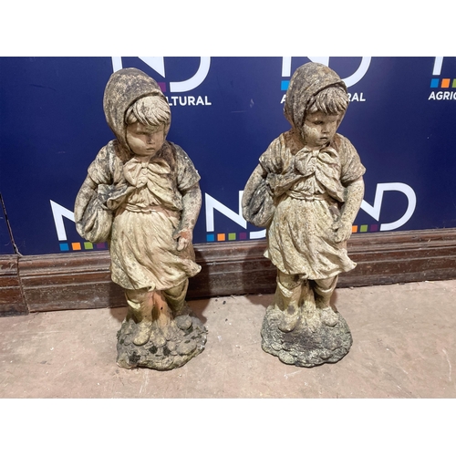 26 - A PAIR OF COMPOSITE STONE FIGURES