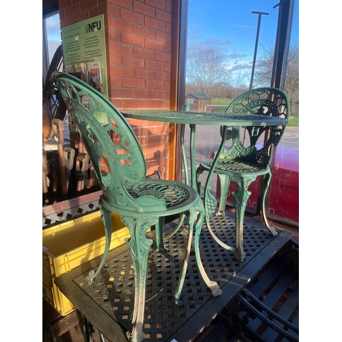 9 - CAST IRON GREEN TABLE & CHAIRS