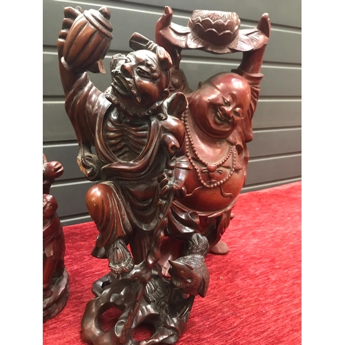 183 - ORIENTAL CARVED WOODEN FIGURES